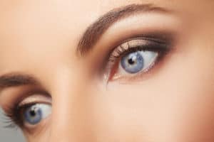 Beautiful human eyes close-up. Young Woman Blue eyes macro shoot. Macro Closeup eye