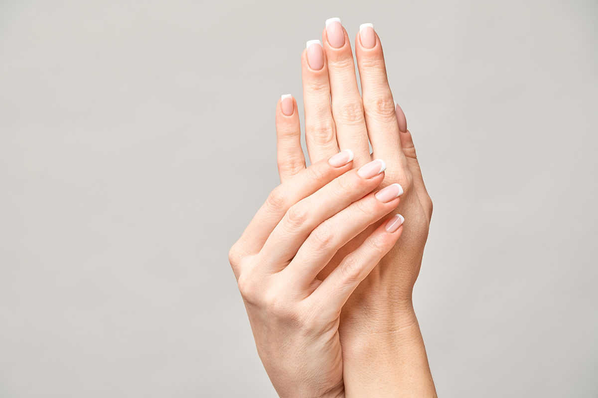 Beautiful female hands with French manicure