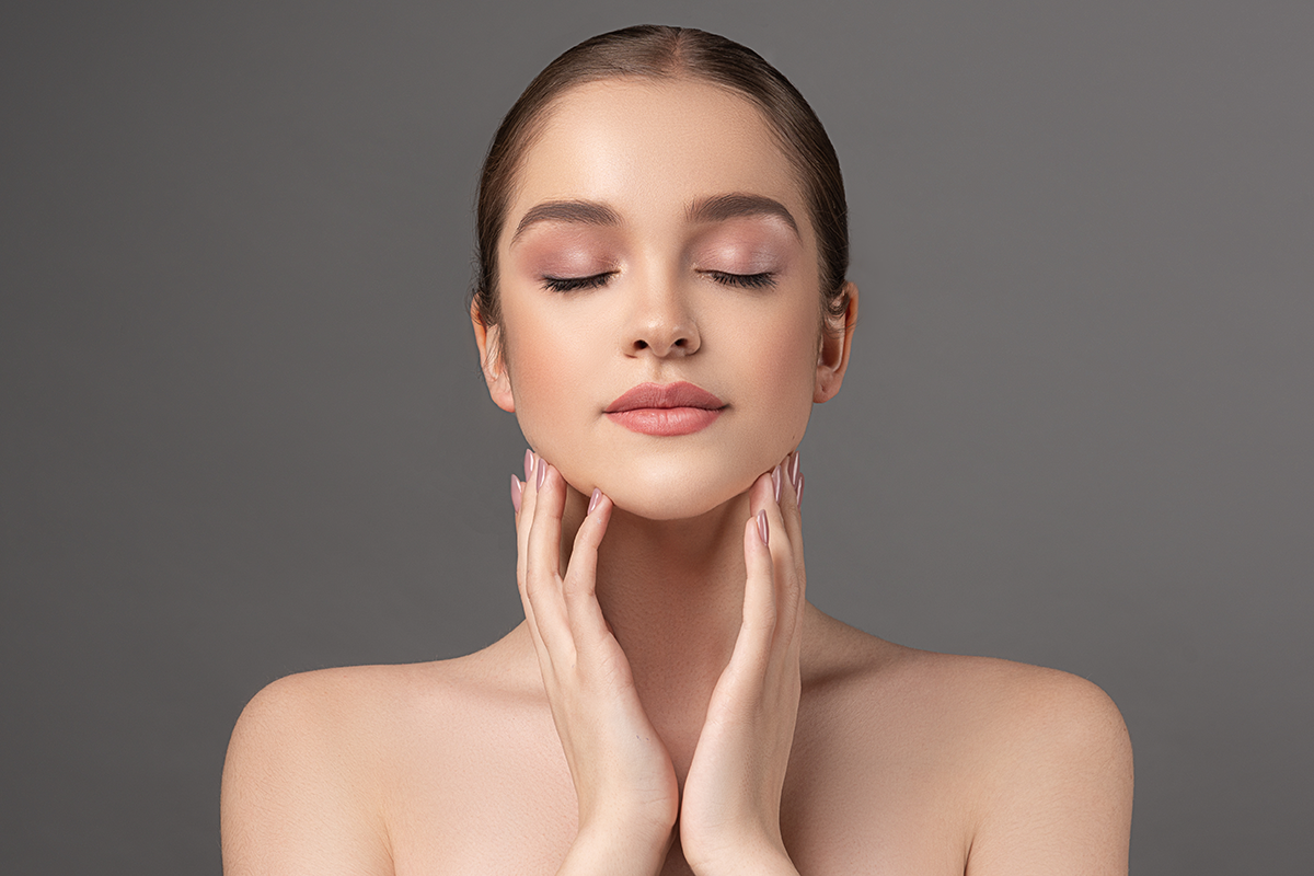 Beautiful young woman with clean fresh skin on face