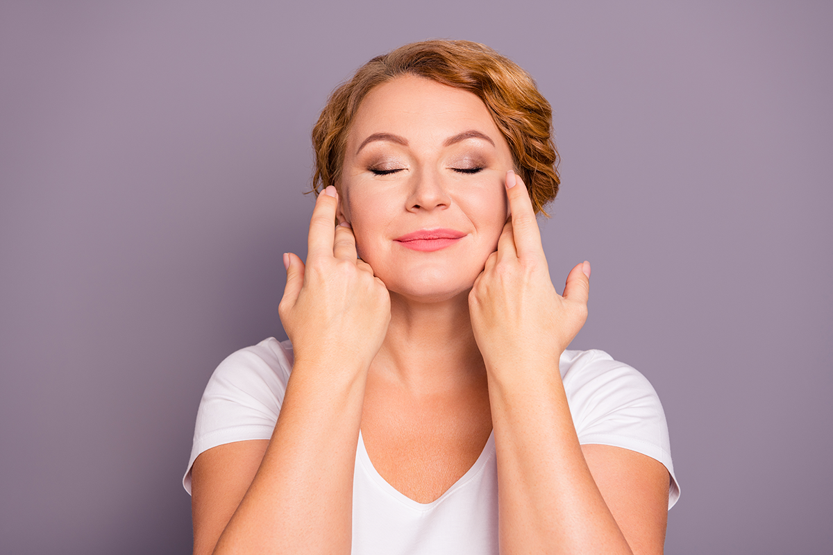 Close up portrait of her she nice cute winsome charming attractive glamorous wavy haired lady wearing casual white t shirt touching flawless face Close up portrait of her she nice cute winsome charming attractive glamorous wavy haired lady wearing casual white t shirt touching flawless face