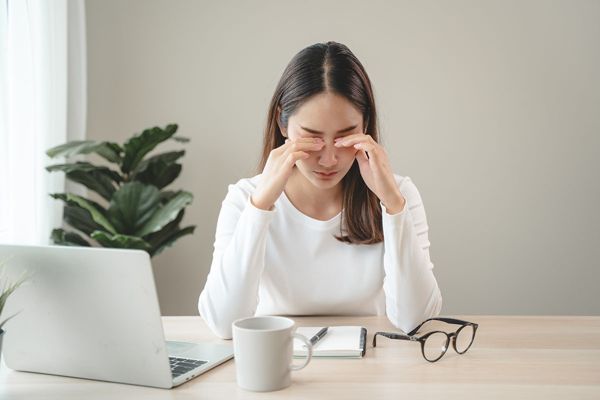 Fatigue Asian young woman tired eyes