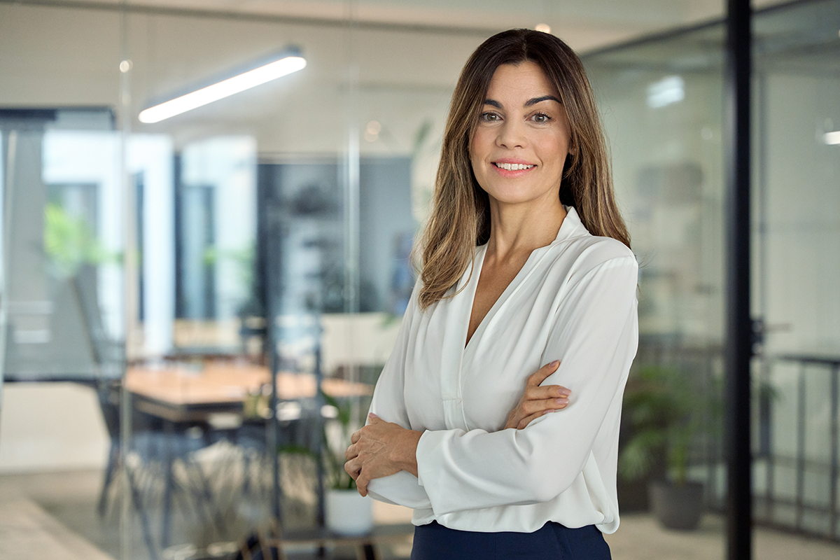 Smiling confident years old Latin professional middle aged woman