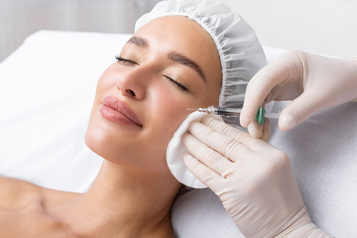 woman receiving anti wrinkle injections on cheekbone