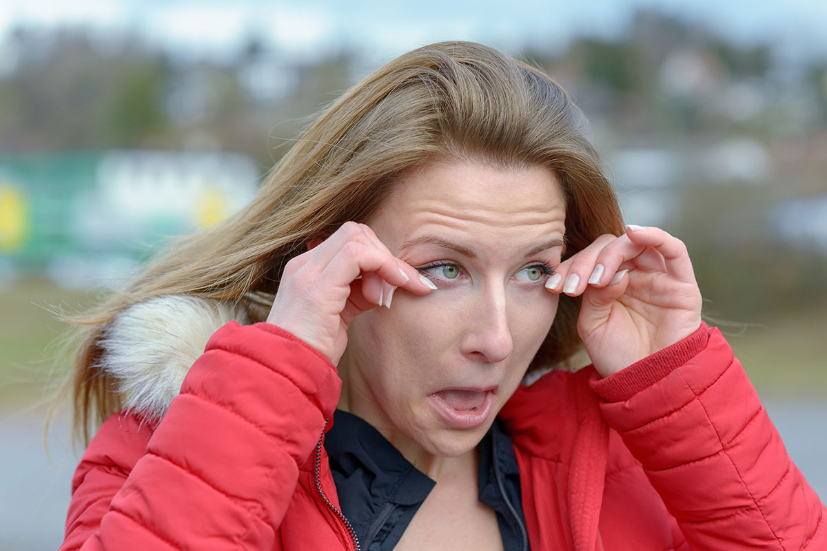 Young woman rubbing her eyes